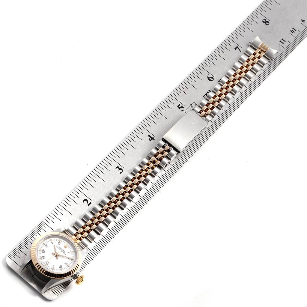 The image shows a Rolex Oyster Perpetual 67193 Women's Steel and Gold (two tone) White Dial 67193 Women's Steel and Gold (two tone) White Dial watch placed alongside a ruler, displaying the watch face, bezel, and the full length of the bracelet.