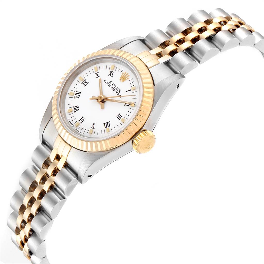 The image shows a Rolex Oyster Perpetual 67193 Women's Steel and Gold (two tone) White Dial 67193 Women's Steel and Gold (two tone) White Dial watch from an angled side view, highlighting the two-tone bracelet, bezel, and crown.