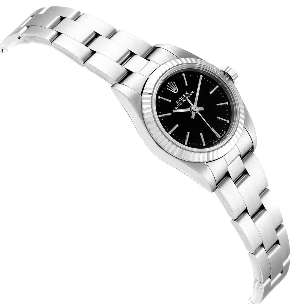 The image shows a Rolex Oyster Perpetual 76094 Women's Stainless Steel Black Dial 76094 Women's Stainless Steel Black Dial watch at an angled view displaying the bracelet, bezel, dial, and crown.