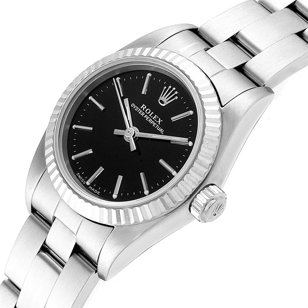 This image shows the Rolex Oyster Perpetual 76094 Women's Stainless Steel Black Dial 76094 Women's Stainless Steel Black Dial watch at an angle, highlighting the dial, bezel, crown, and part of the bracelet.