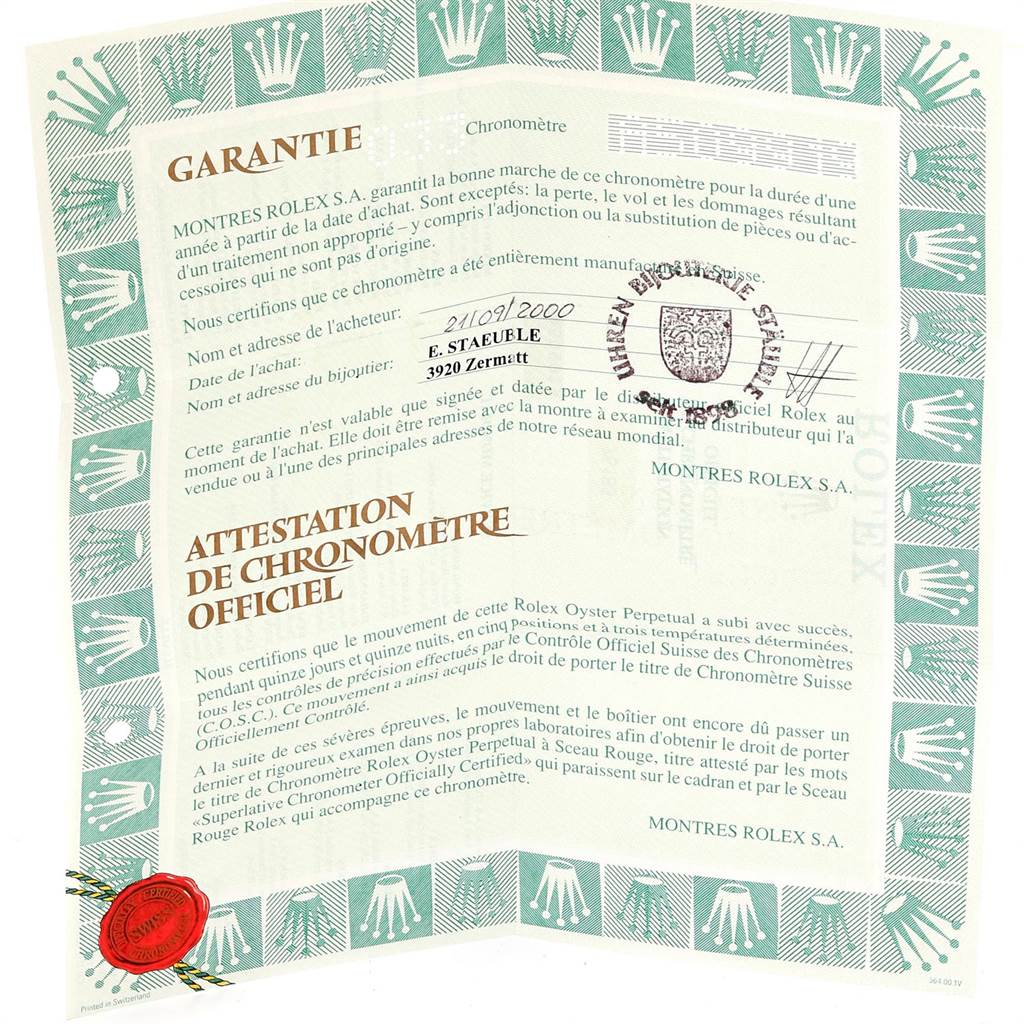 This image shows a guarantee and official chronometer certificate for a Rolex Oyster Perpetual 76183 Women's Steel and Gold (two tone) Champagne Dial 76183 Women's Steel and Gold (two tone) Champagne Dial watch.