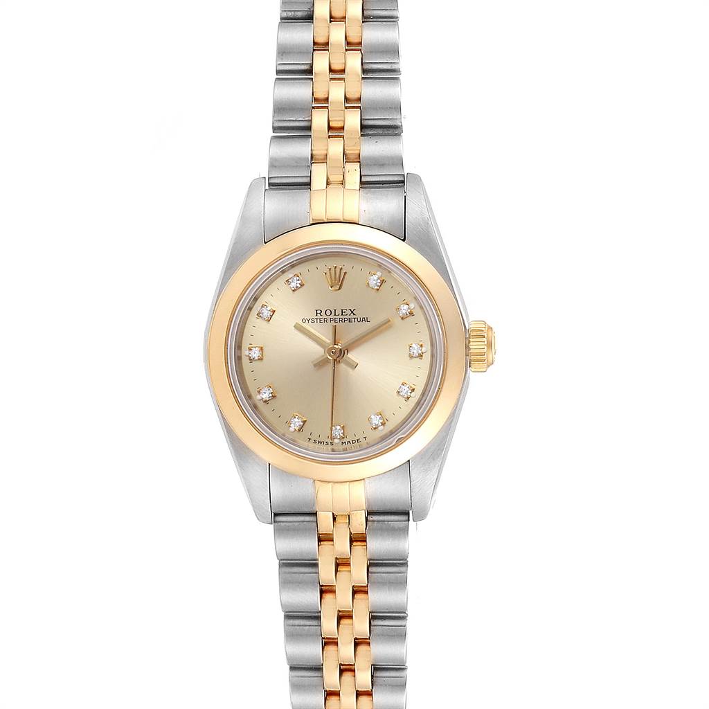 This image shows a Rolex Oyster Perpetual 76183 Women's Steel and Gold (two tone) Champagne Dial 76183 Women's Steel and Gold (two tone) Champagne Dial watch from a front angle, highlighting its gold bezel, dial, and two-tone bracelet.