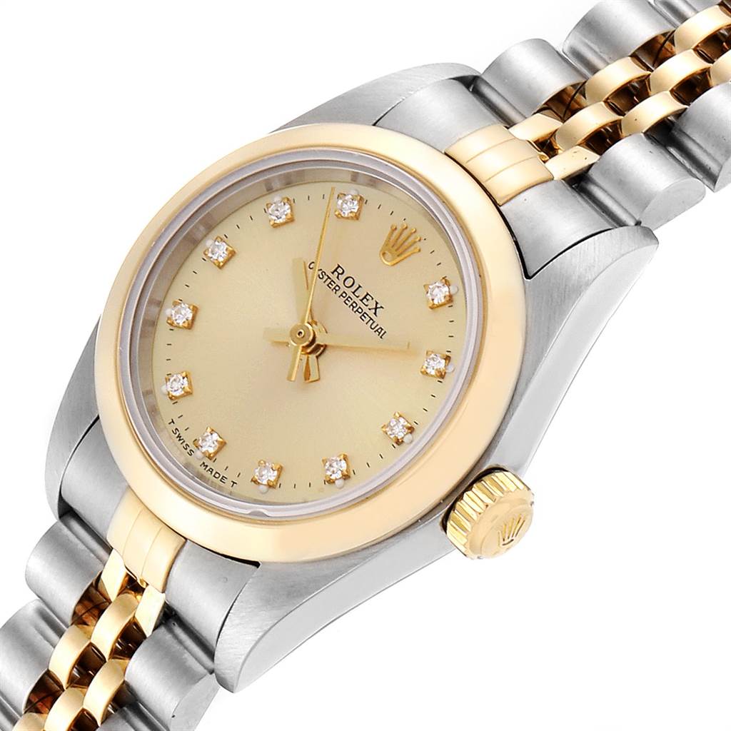 The image shows a close-up angle of the Rolex Oyster Perpetual 76183 Women's Steel and Gold (two tone) Champagne Dial 76183 Women's Steel and Gold (two tone) Champagne Dial watch, focusing on its dial, crown, and part of the bracelet.