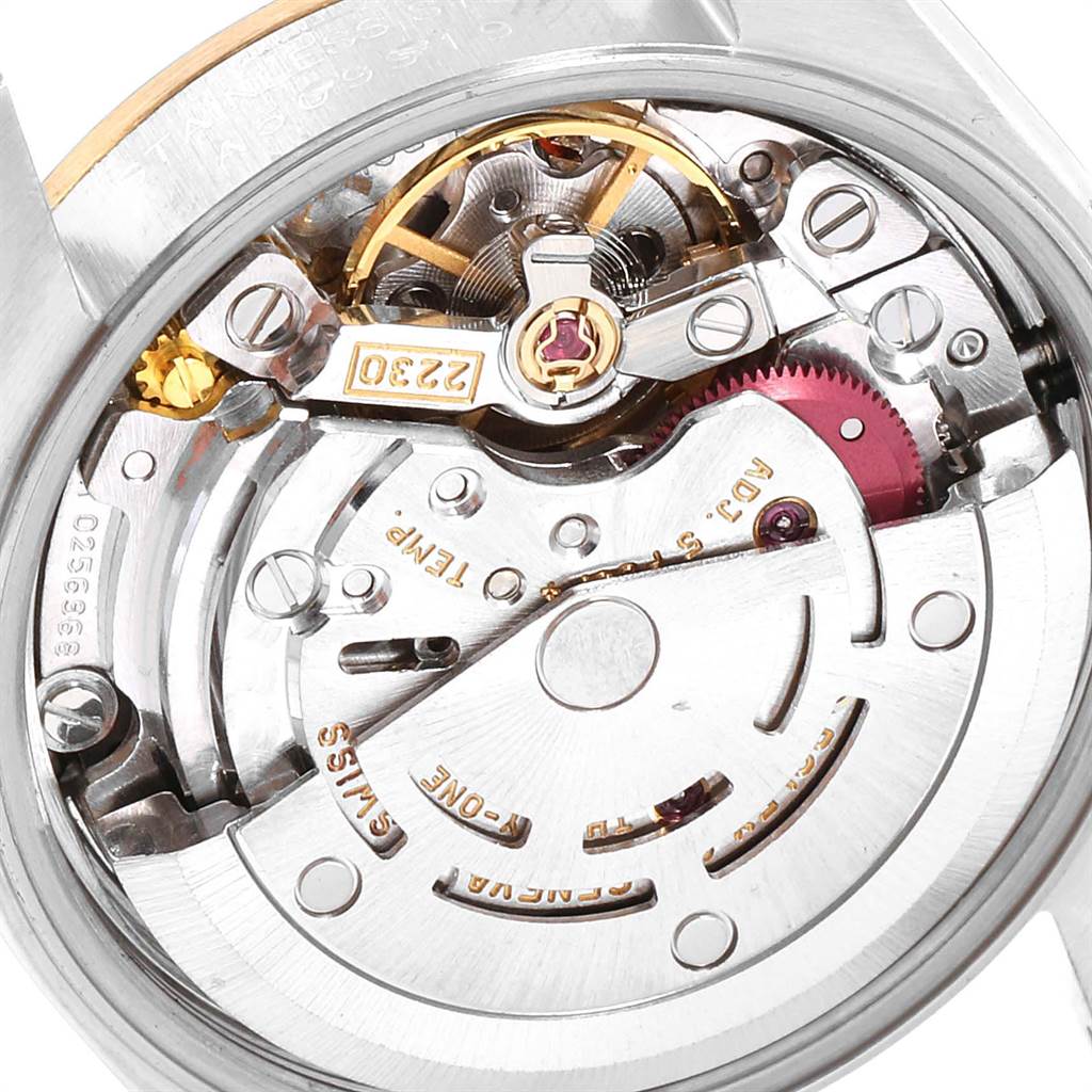 The image shows an internal view of the movement mechanism of a Rolex Oyster Perpetual 76183 Women's Steel and Gold (two tone) Champagne Dial 76183 Women's Steel and Gold (two tone) Champagne Dial watch.