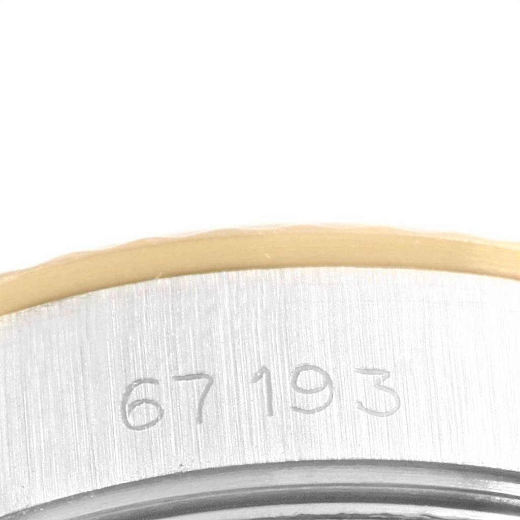 This image shows a close-up of the case side engraving on the Rolex Oyster Perpetual 67193 Women's Steel and Gold (two tone) Champagne Dial 67193 Women's Steel and Gold (two tone) Champagne Dial watch.