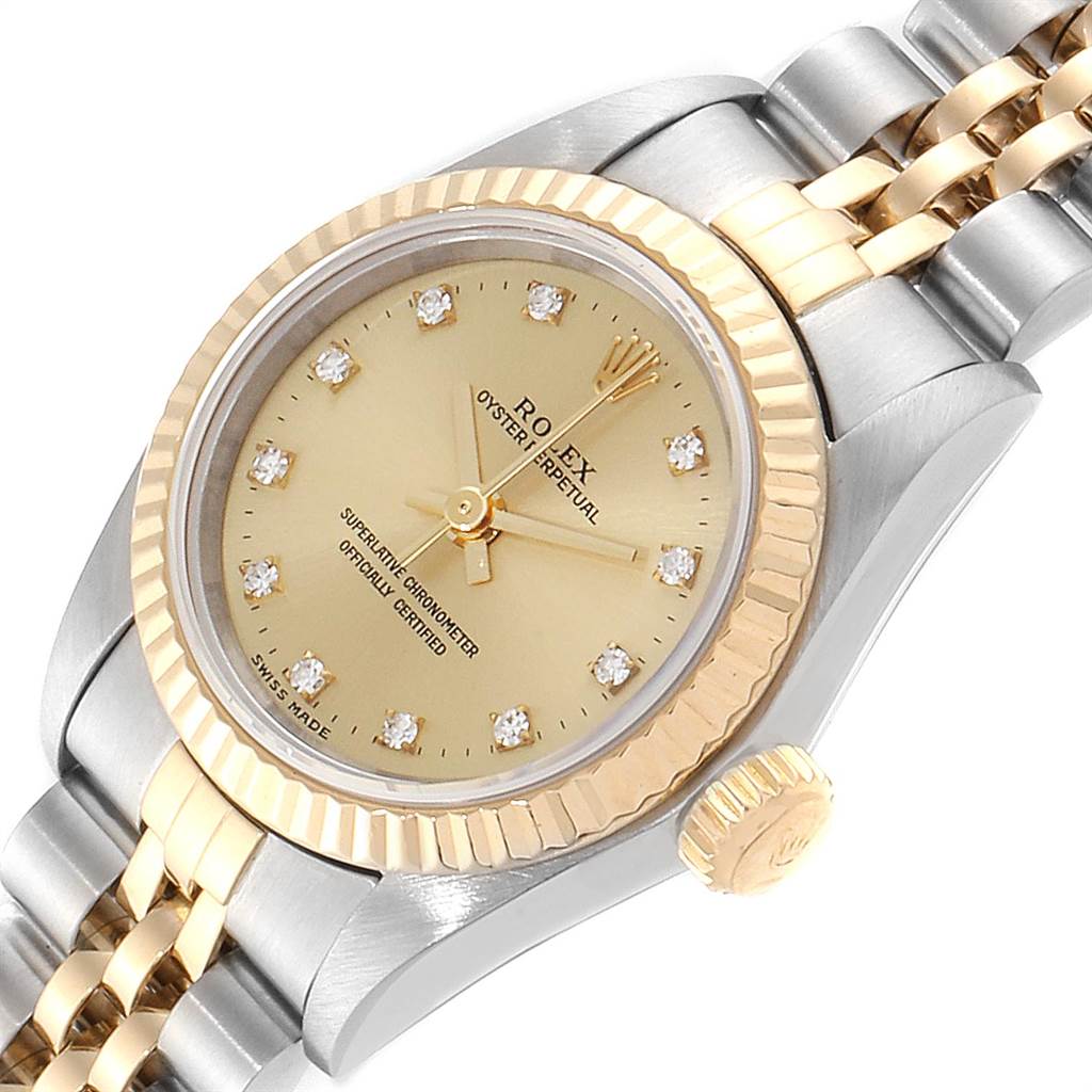 The image shows a close-up of a Rolex Oyster Perpetual 67193 Women's Steel and Gold (two tone) Champagne Dial 67193 Women's Steel and Gold (two tone) Champagne Dial watch, focusing on the dial, crown, and a portion of the bracelet.