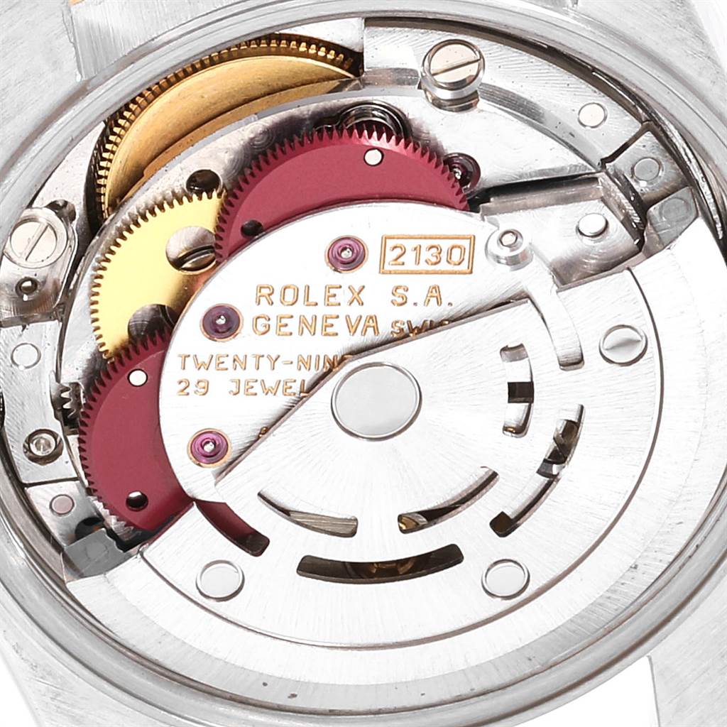 This image shows a close-up view of the movement mechanism inside a Rolex Oyster Perpetual 67193 Women's Steel and Gold (two tone) Champagne Dial 67193 Women's Steel and Gold (two tone) Champagne Dial watch.