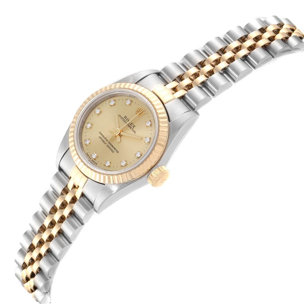 The Rolex Oyster Perpetual 67193 Women's Steel and Gold (two tone) Champagne Dial 67193 Women's Steel and Gold (two tone) Champagne Dial watch is shown at a slight angle, highlighting the dial, bezel, crown, and a portion of the bracelet.
