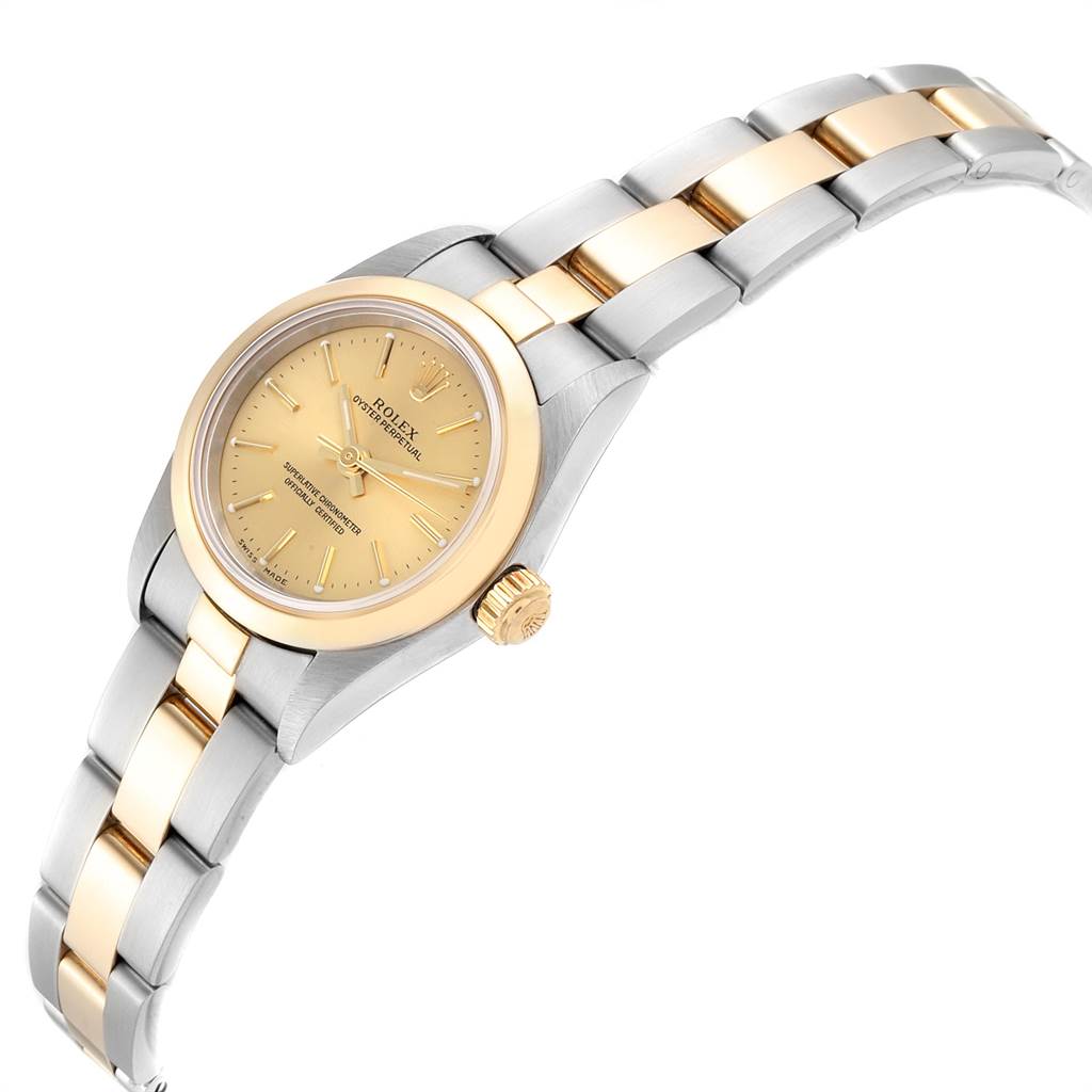 The Rolex Oyster Perpetual 76183 Women
s Steel and Gold (two tone) Champagne Dial 76183 Women
s Steel and Gold (two tone) Champagne Dial watch is shown at an angle, displaying the face, bezel, crown, and two-tone bracelet.