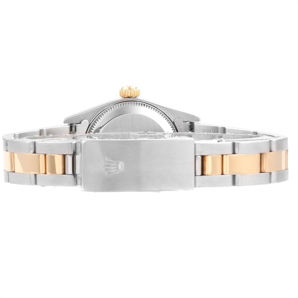 The image shows the back view of the Rolex Oyster Perpetual 76183 Women
s Steel and Gold (two tone) Champagne Dial 76183 Women
s Steel and Gold (two tone) Champagne Dial watch, displaying its clasp, bracelet, and caseback.