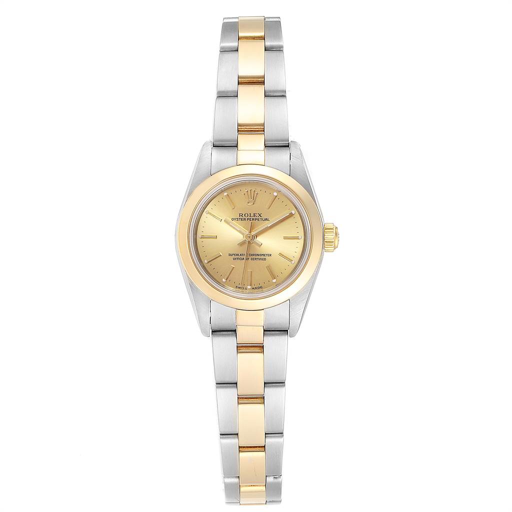 The Rolex Oyster Perpetual 76183 Women
s Steel and Gold (two tone) Champagne Dial 76183 Women
s Steel and Gold (two tone) Champagne Dial watch is shown from a top-down angle, featuring its gold and silver two-tone bracelet and champagne dial.