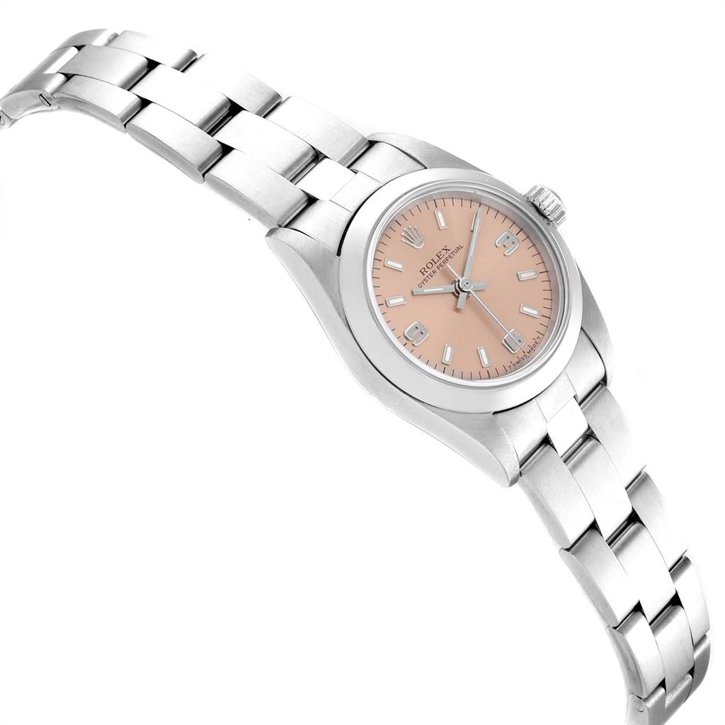 The image shows a side angle view of a Rolex Oyster Perpetual 67180 Women's Stainless Steel Pink Dial 67180 Women's Stainless Steel Pink Dial watch, displaying its face, bezel, crown, and bracelet.
