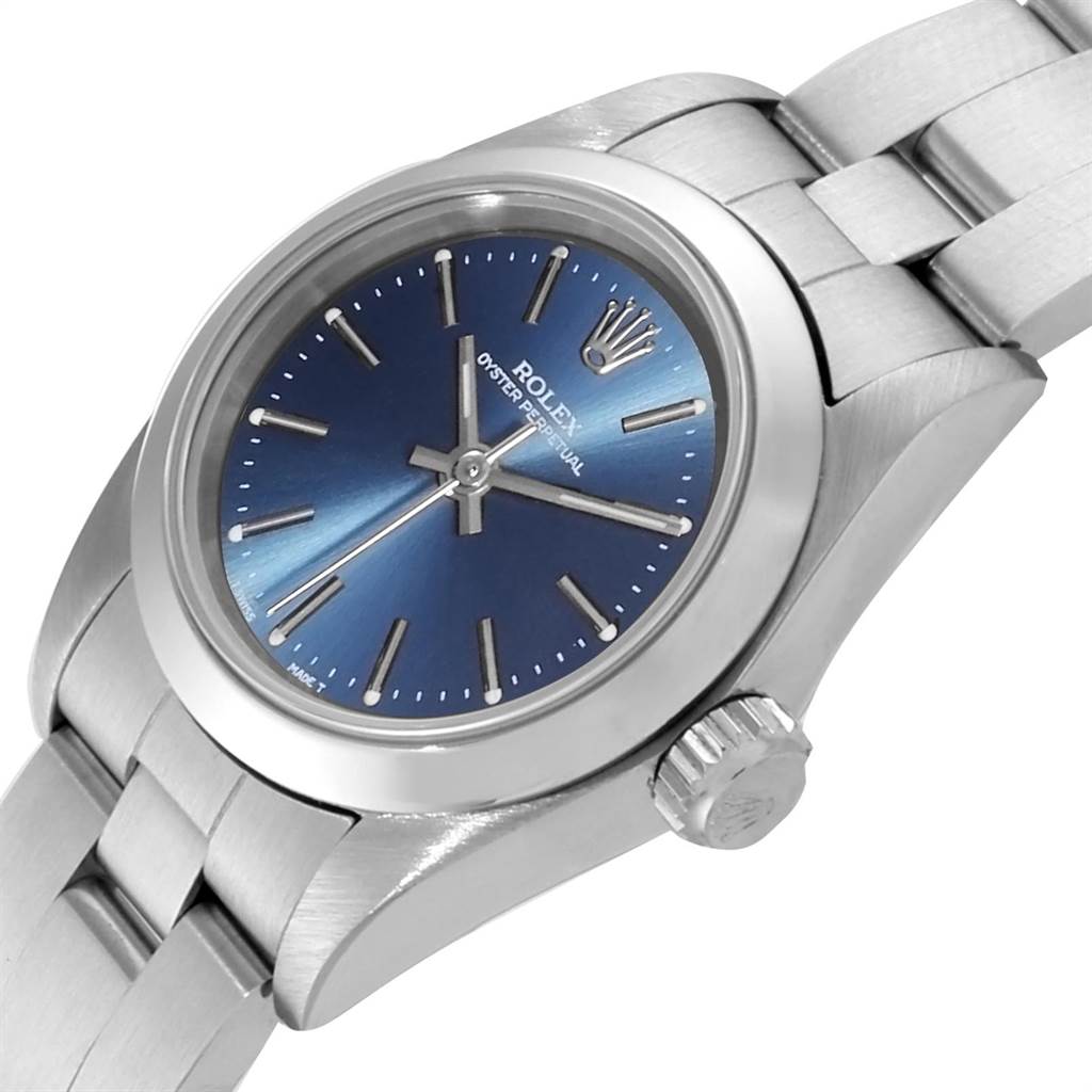 The image shows a Rolex Oyster Perpetual 67180 Women's Stainless Steel Blue Dial 67180 Women's Stainless Steel Blue Dial watch at an angle that highlights the dial, bezel, crown, and part of the bracelet.