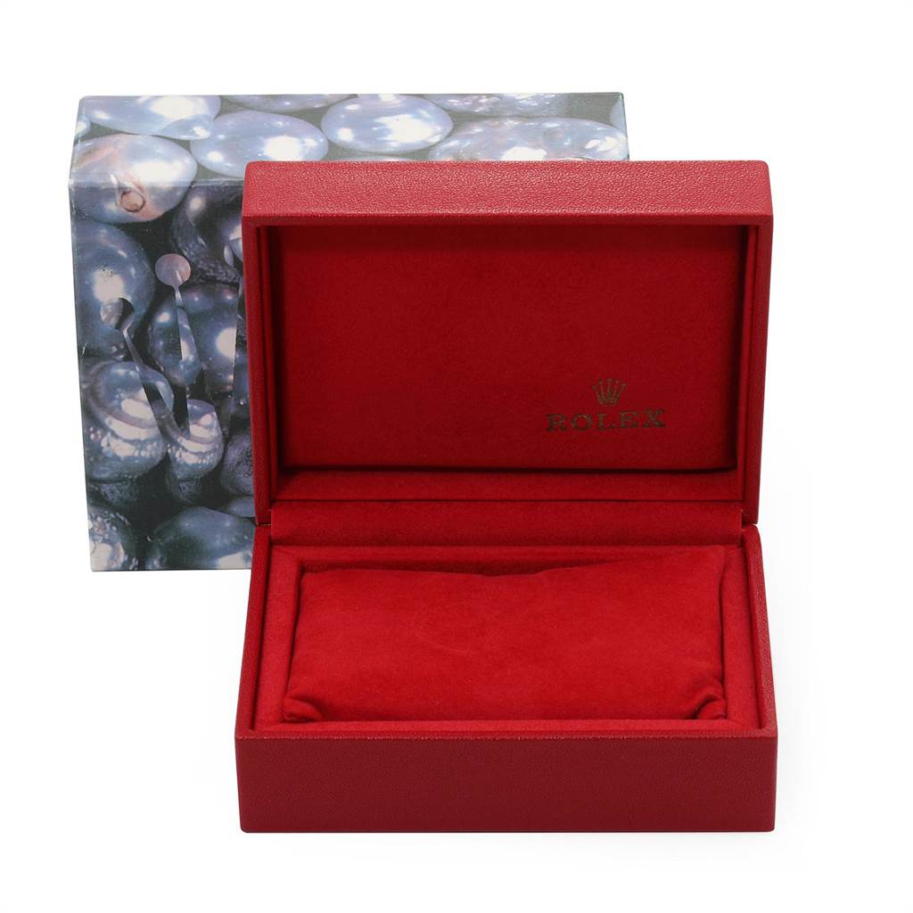 This image shows an open red Rolex watch box designed for an Oyster Perpetual model.