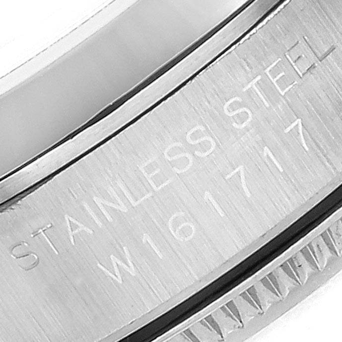 This image shows a close-up of the side engraving on a stainless steel Rolex Oyster Perpetual 67180 Women's Stainless Steel Blue Dial 67180 Women's Stainless Steel Blue Dial watch.