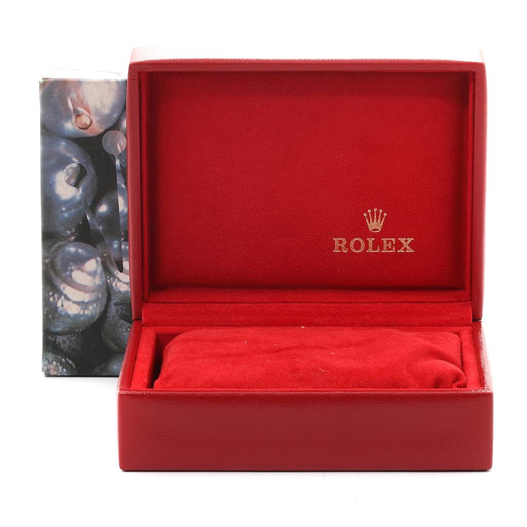 This image shows an open red Rolex watch box for the Oyster Perpetual model.