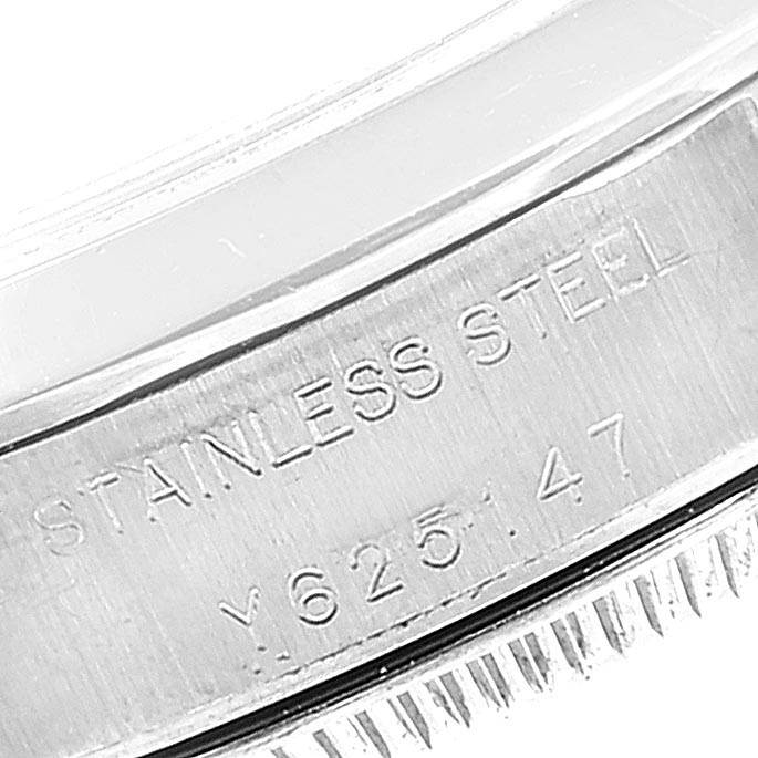The image shows a close-up view of the case back of a Rolex Oyster Perpetual 76080 Women's Stainless Steel Black Dial 76080 Women's Stainless Steel Black Dial, highlighting the stainless steel engraving and a serial number.