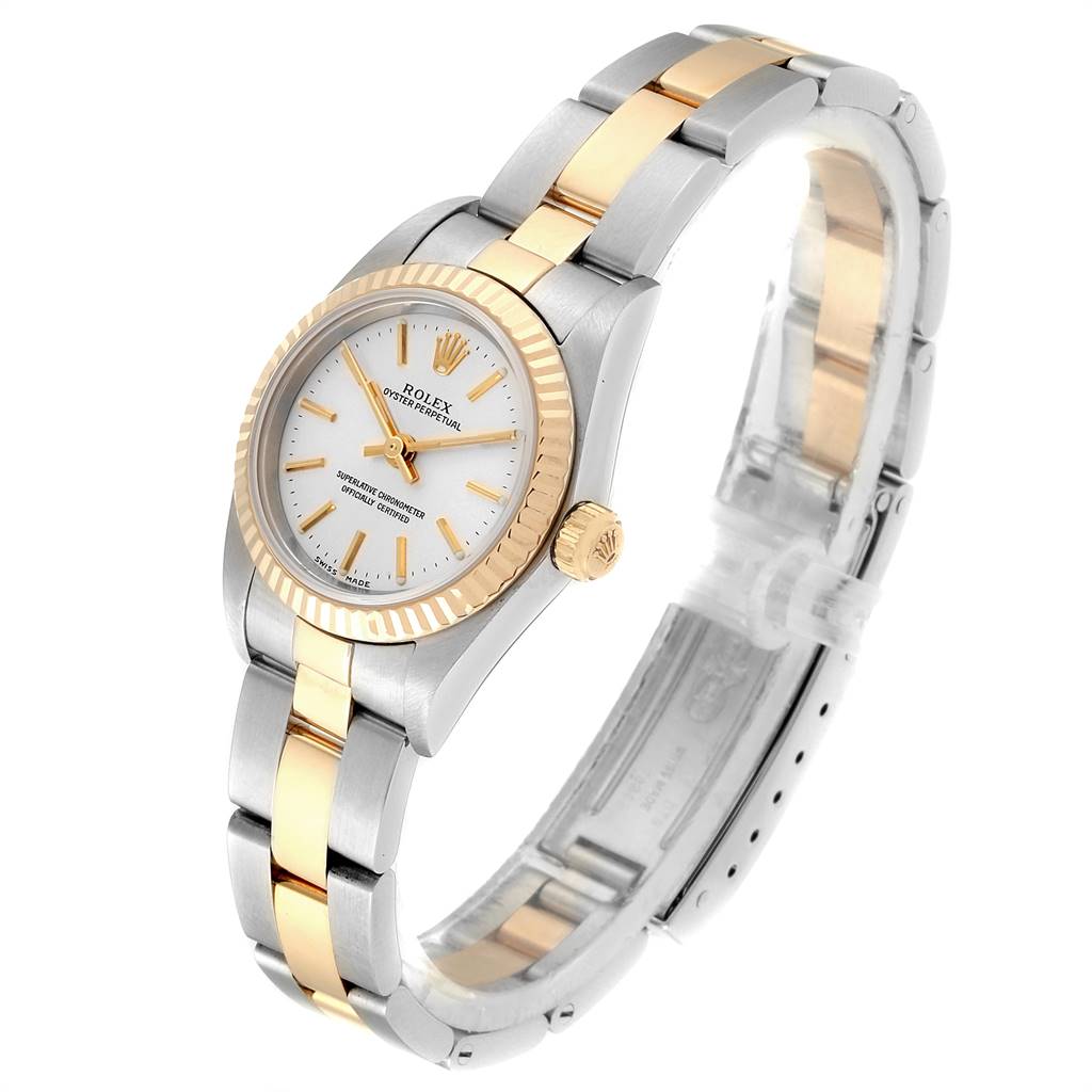 The Rolex Oyster Perpetual 76193 Women's Steel and Gold (two tone) Silver Dial 76193 Women's Steel and Gold (two tone) Silver Dial watch is shown at a slight angle displaying its face, bezel, crown, and a portion of its bracelet.