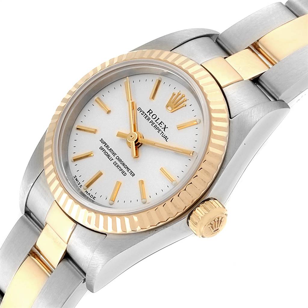 This image displays a Rolex Oyster Perpetual 76193 Women's Steel and Gold (two tone) Silver Dial 76193 Women's Steel and Gold (two tone) Silver Dial watch from an angled perspective, showing the watch face, bezel, crown, and part of the bracelet.