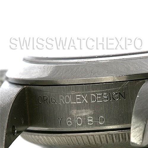 The image shows a close-up of the side of a Rolex Oyster Perpetual 76080 Women's Stainless Steel White Dial 76080 Women's Stainless Steel White Dial watch case, displaying its engraved design and model number.