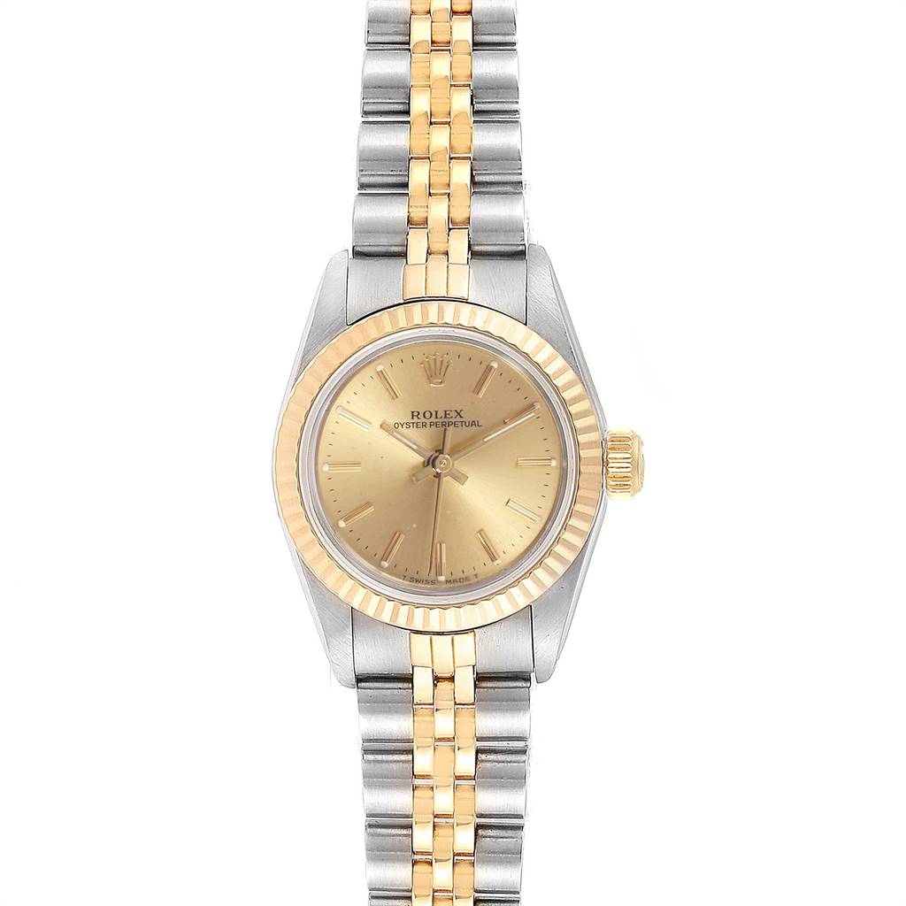 This Rolex Oyster Perpetual 67193 Women's Steel and Gold (two tone) Champagne Dial 67193 Women's Steel and Gold (two tone) Champagne Dial watch is shown from the front, featuring its face, bezel, case, and bracelet.