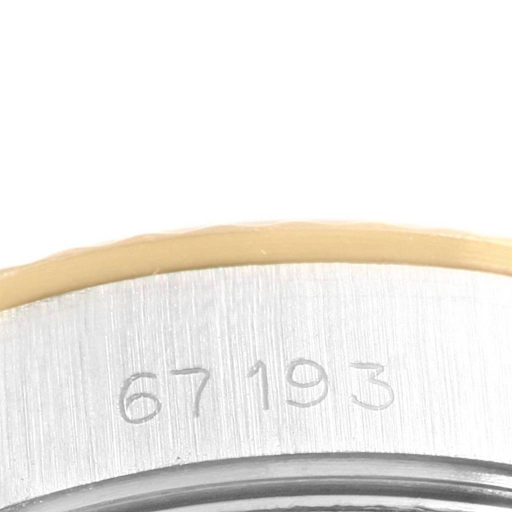 This close-up image shows the case back with the reference number engraved on the Rolex Oyster Perpetual 67193 Women's Steel and Gold (two tone) Champagne Dial 67193 Women's Steel and Gold (two tone) Champagne Dial watch.