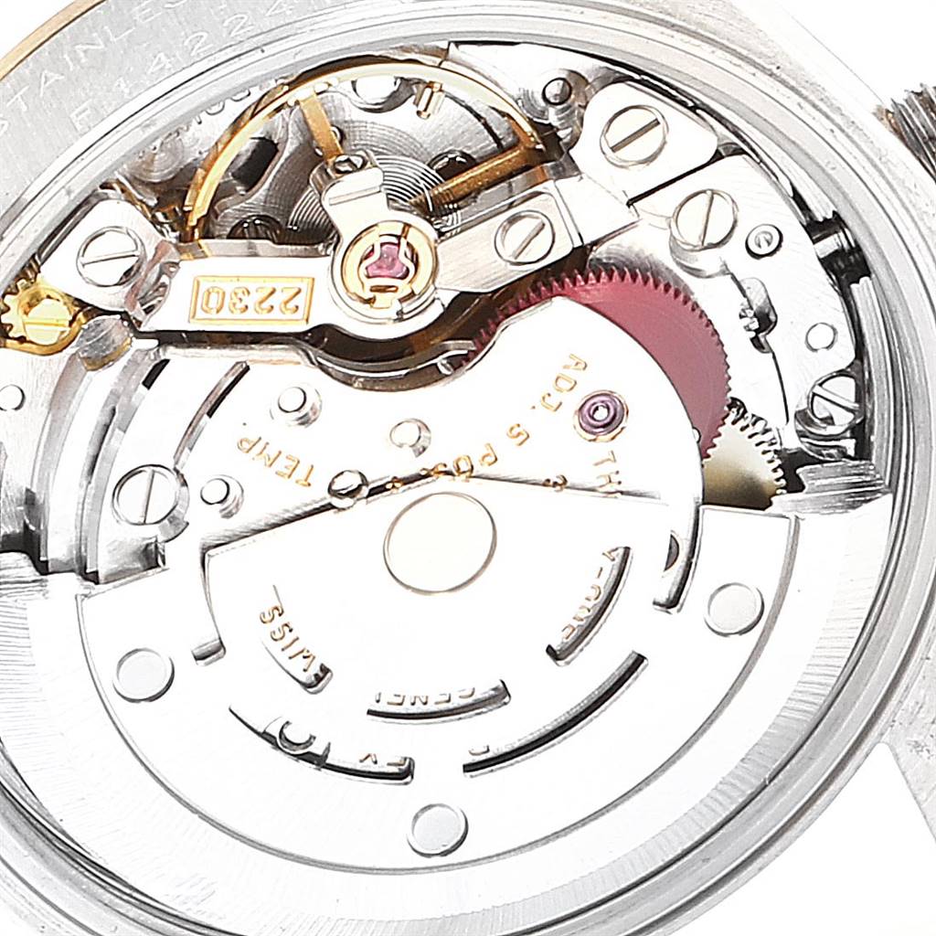 This image shows the intricate internal mechanism of a Rolex Oyster Perpetual 76193 Women's Steel and Gold (two tone) Silver Dial 76193 Women's Steel and Gold (two tone) Silver Dial watch viewed from the back.