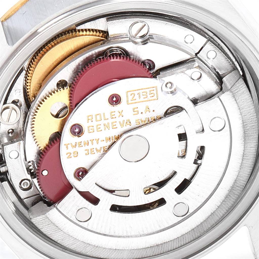 The image shows the inner mechanical parts and movement of a Rolex Oyster Perpetual 69173 Women's Stainless Steel Champagne Dial 69173 Women's Stainless Steel Champagne Dial watch from a close-up angle.