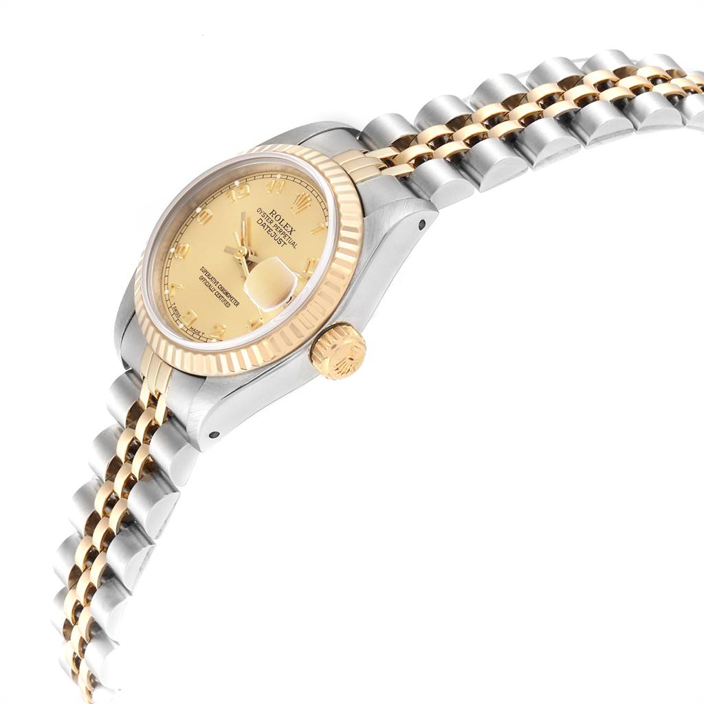 The image shows a side angle of the Rolex Oyster Perpetual 69173 Women's Stainless Steel Champagne Dial 69173 Women's Stainless Steel Champagne Dial watch, highlighting the bezel, crown, and part of the bracelet.