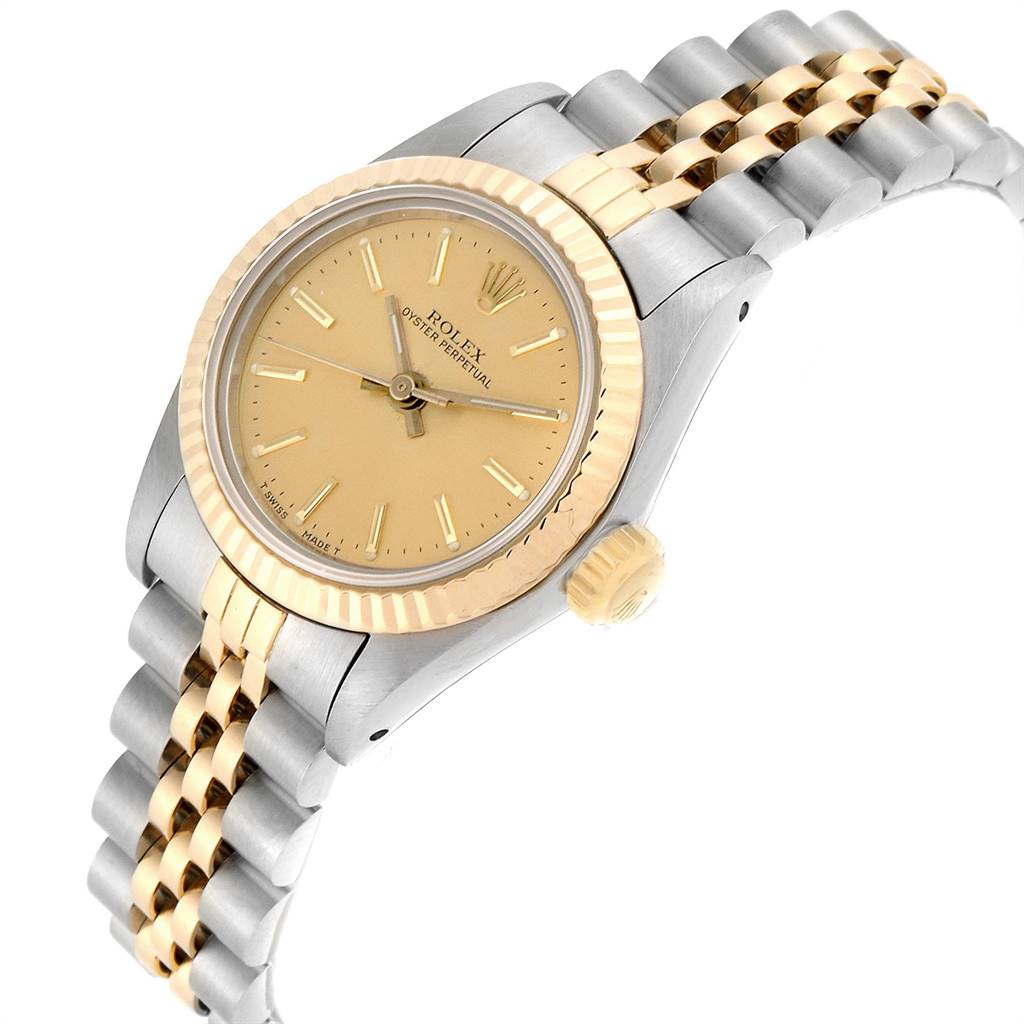 The image shows a Rolex Oyster Perpetual 67193 Women
s Steel and Gold (two tone) Champagne Dial 67193 Women
s Steel and Gold (two tone) Champagne Dial watch at a three-quarter angle, highlighting the dial, bezel, and bracelet.