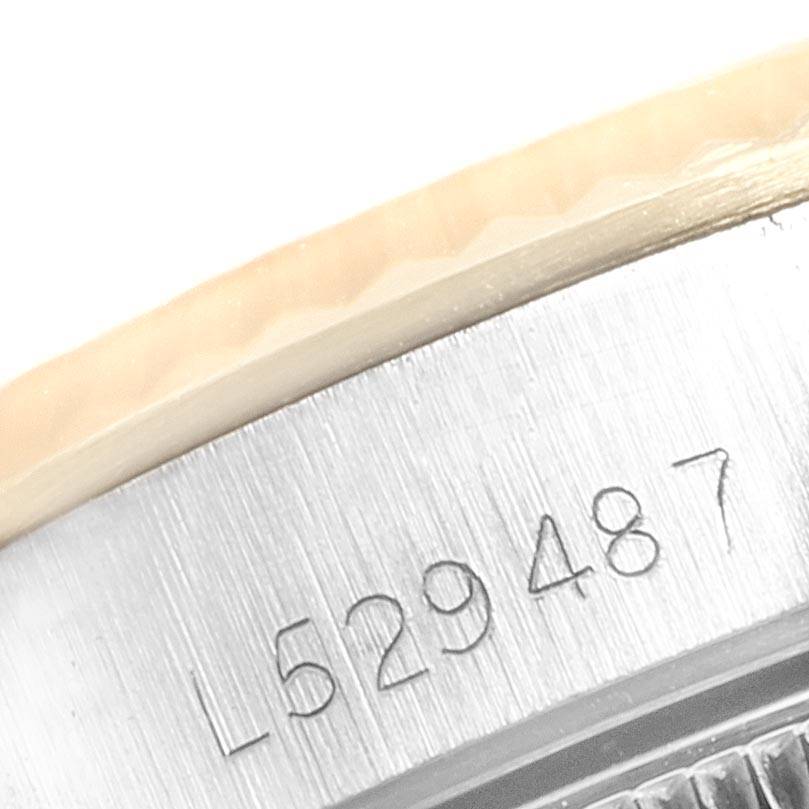 This image shows a partial view of the caseback rim of the Rolex Oyster Perpetual 67193 Women
s Steel and Gold (two tone) Champagne Dial 67193 Women
s Steel and Gold (two tone) Champagne Dial, focusing on the serial number engraving.