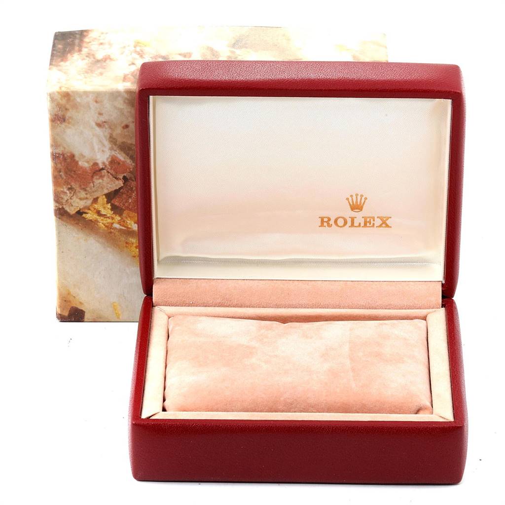 The image shows an empty Rolex Oyster Perpetual 67193 Women
s Steel and Gold (two tone) Champagne Dial 67193 Women
s Steel and Gold (two tone) Champagne Dial watch box from a front-facing angle, with the brand logo inside the lid.