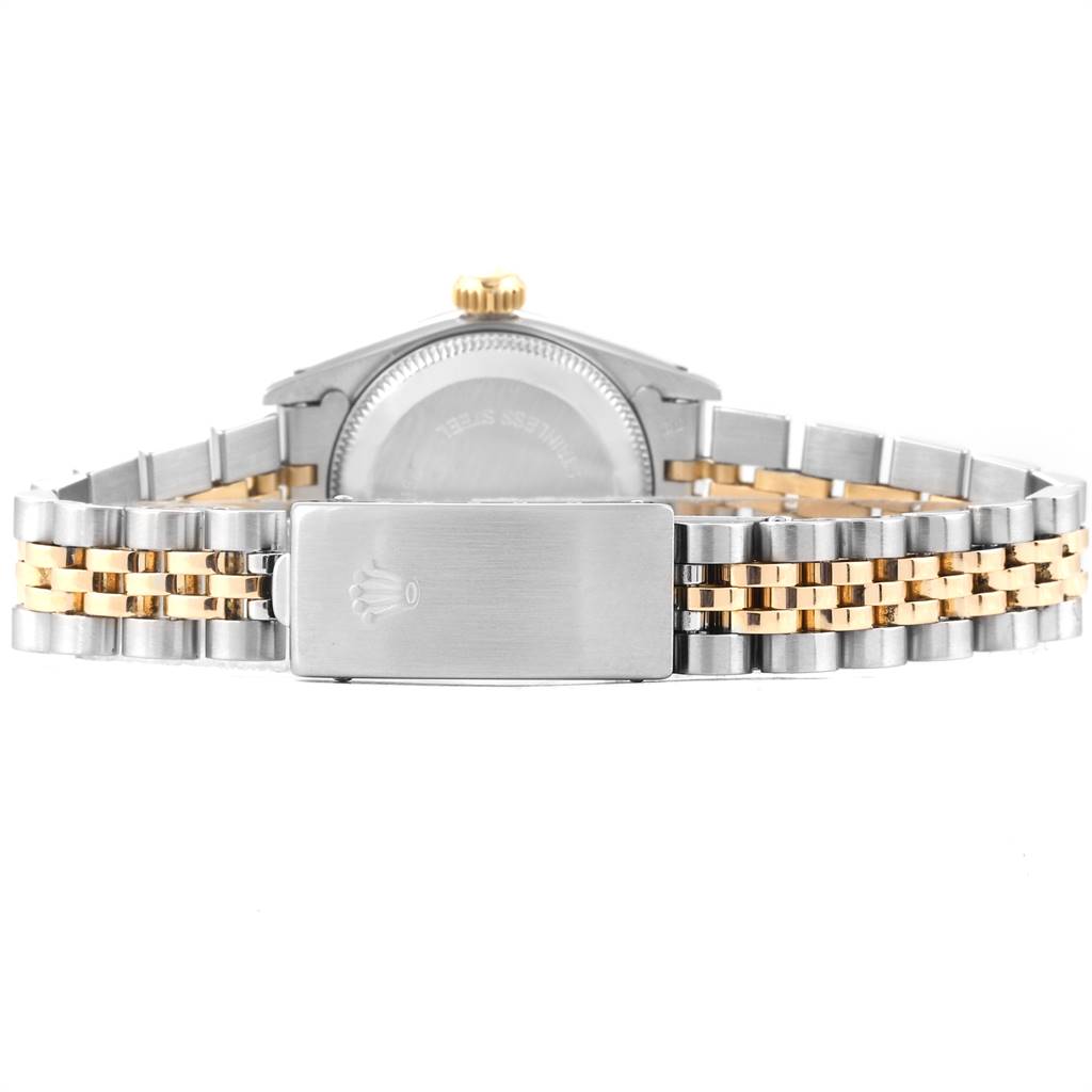 This image shows the back view of a Rolex Oyster Perpetual 67193 Women
s Steel and Gold (two tone) Champagne Dial 67193 Women
s Steel and Gold (two tone) Champagne Dial watch, featuring its two-tone Jubilee bracelet and clasp.