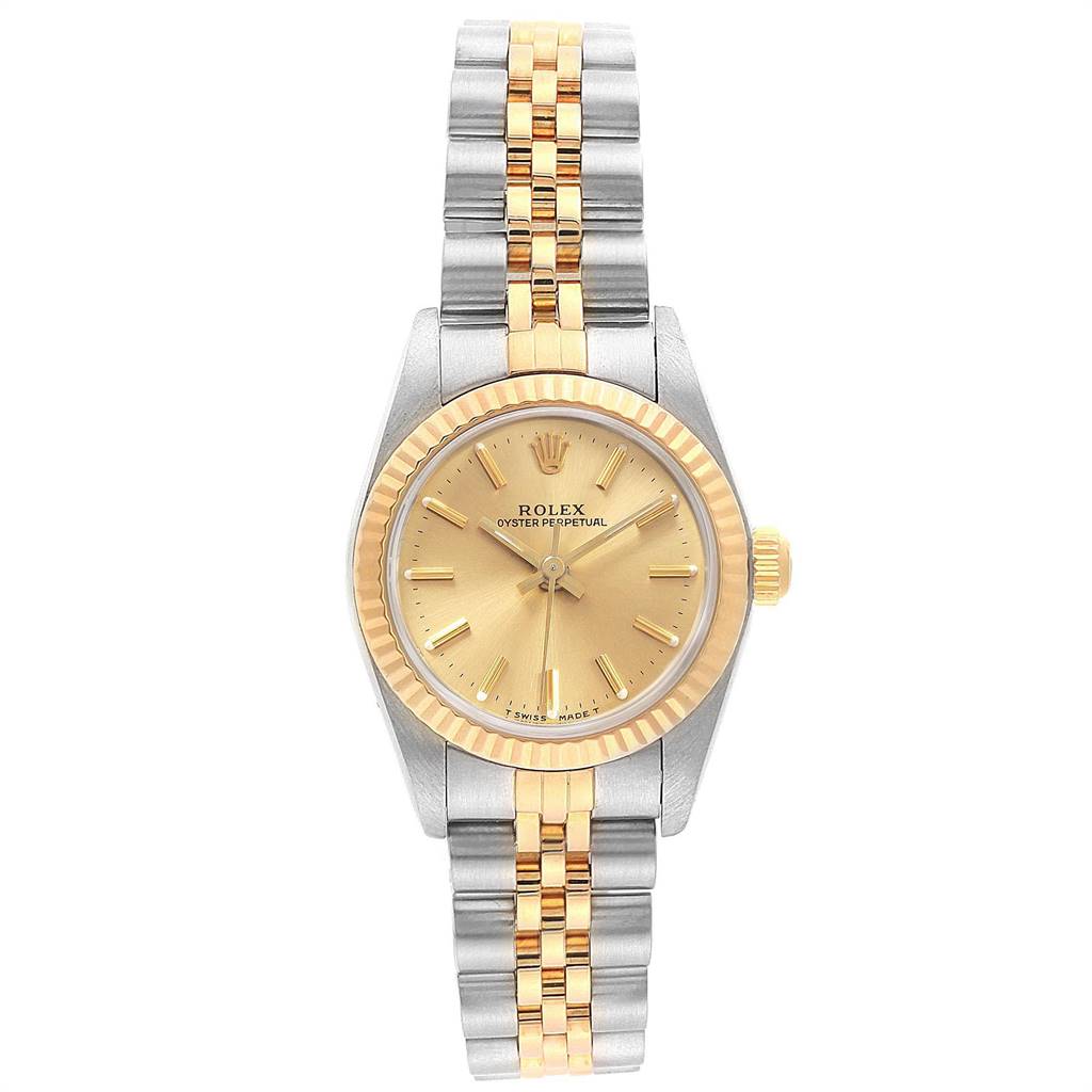 The image shows a front view of a Rolex Oyster Perpetual 67193 Women
s Steel and Gold (two tone) Champagne Dial 67193 Women
s Steel and Gold (two tone) Champagne Dial watch with a gold and silver bracelet and gold bezel.