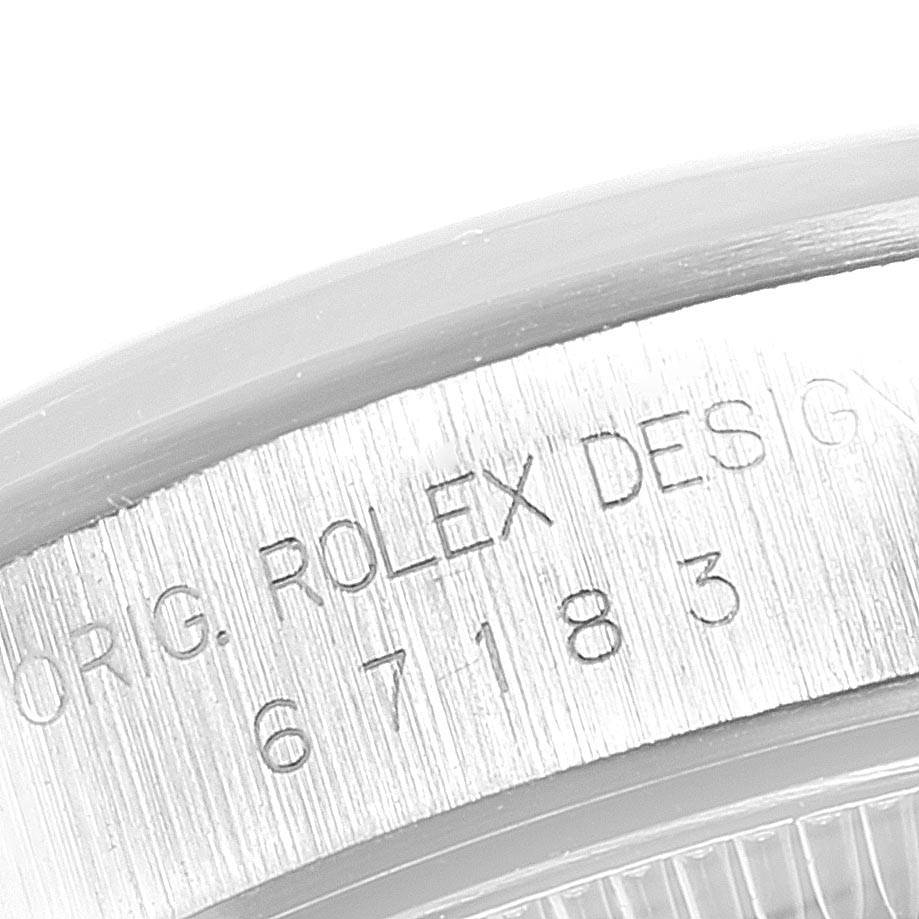 This is a close-up shot of the case back engraving of the Rolex Oyster Perpetual 67183 Women's Steel and Gold (two tone) Silver Dial 67183 Women's Steel and Gold (two tone) Silver Dial watch.