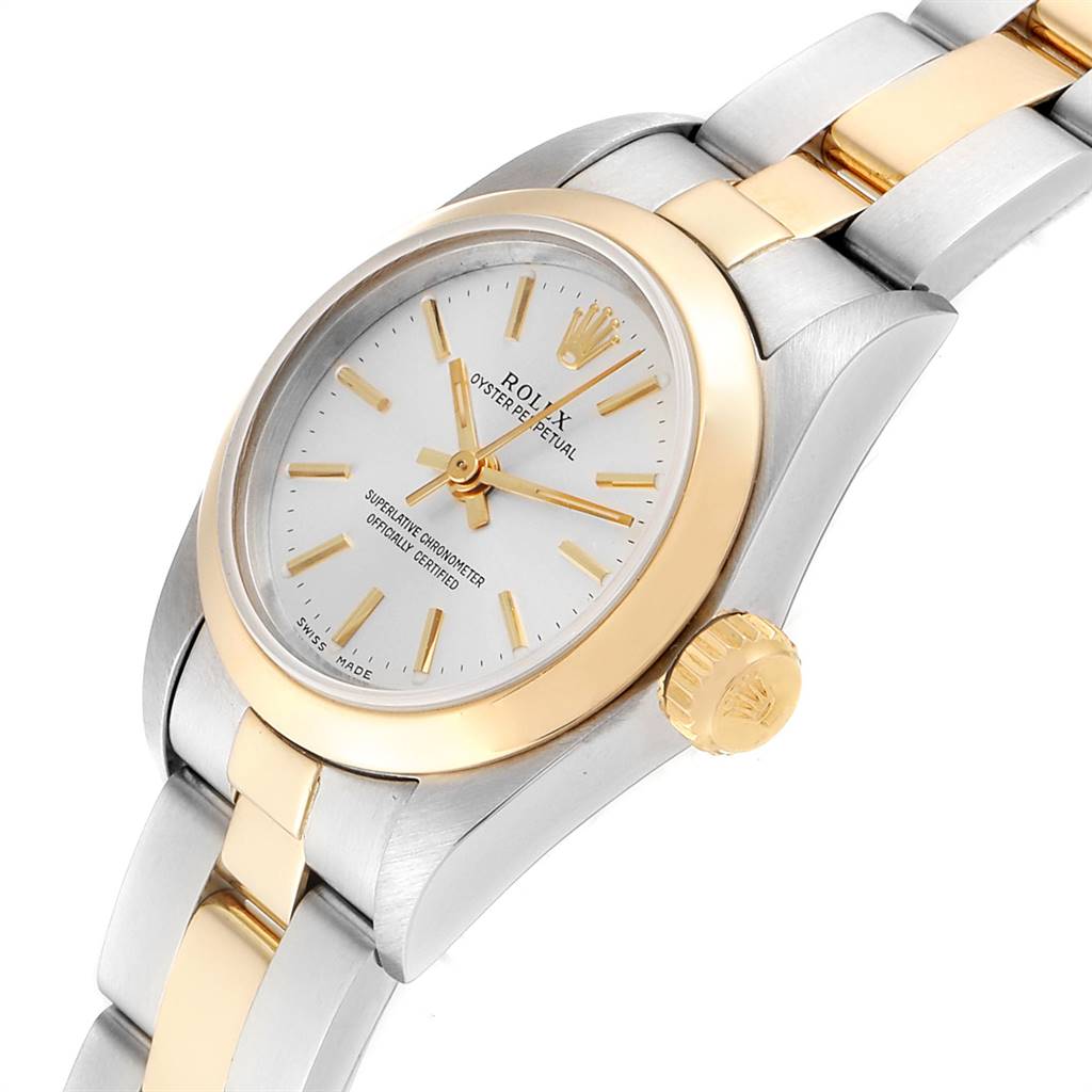 The Rolex Oyster Perpetual 67183 Women's Steel and Gold (two tone) Silver Dial 67183 Women's Steel and Gold (two tone) Silver Dial watch is shown at an angle displaying the face, crown, and a partial view of the bracelet.