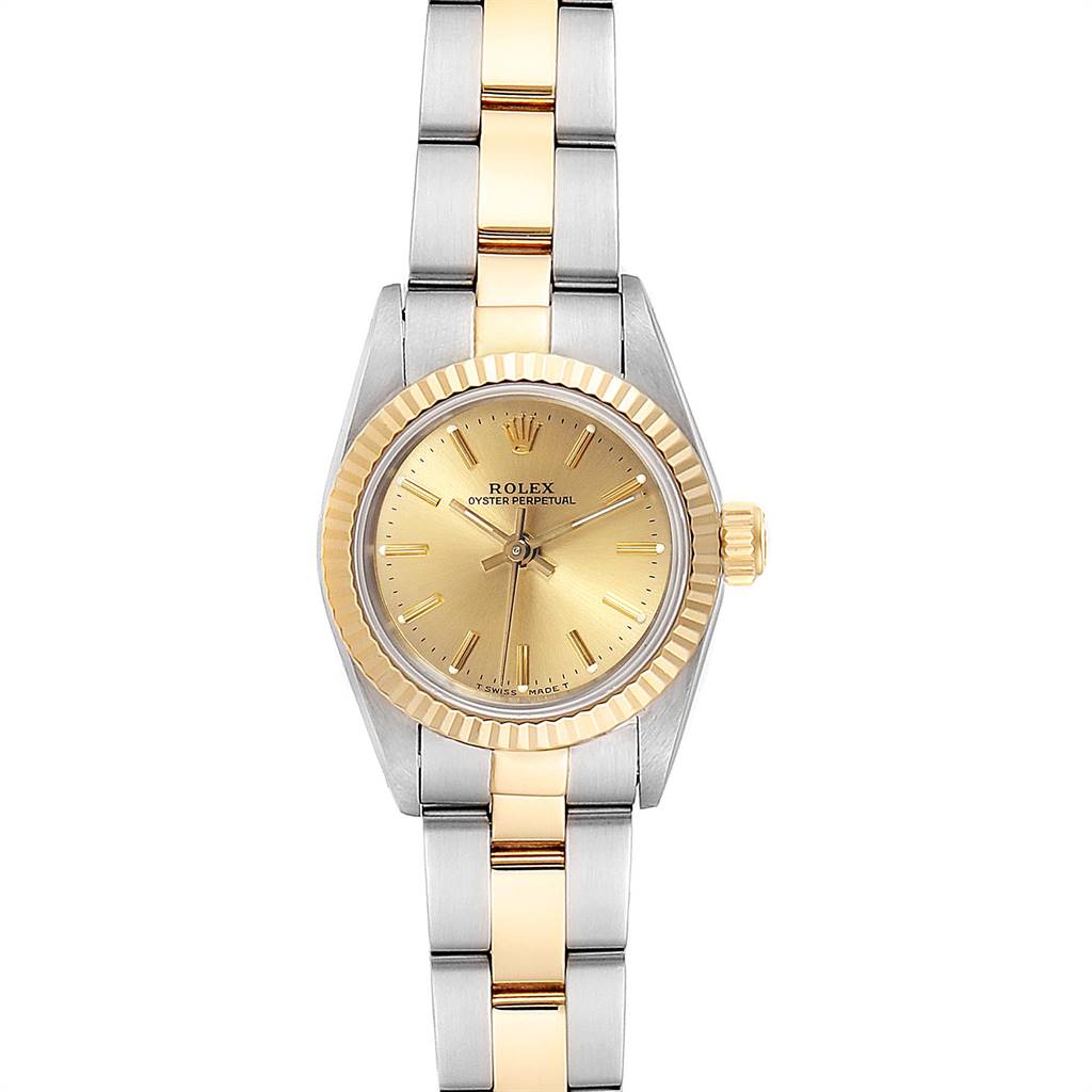 The Rolex Oyster Perpetual 67193 Women's Steel and Gold (two tone) Champagne Dial 67193 Women's Steel and Gold (two tone) Champagne Dial watch is shown from a front angle, displaying the gold and silver bracelet, bezel, and dial.