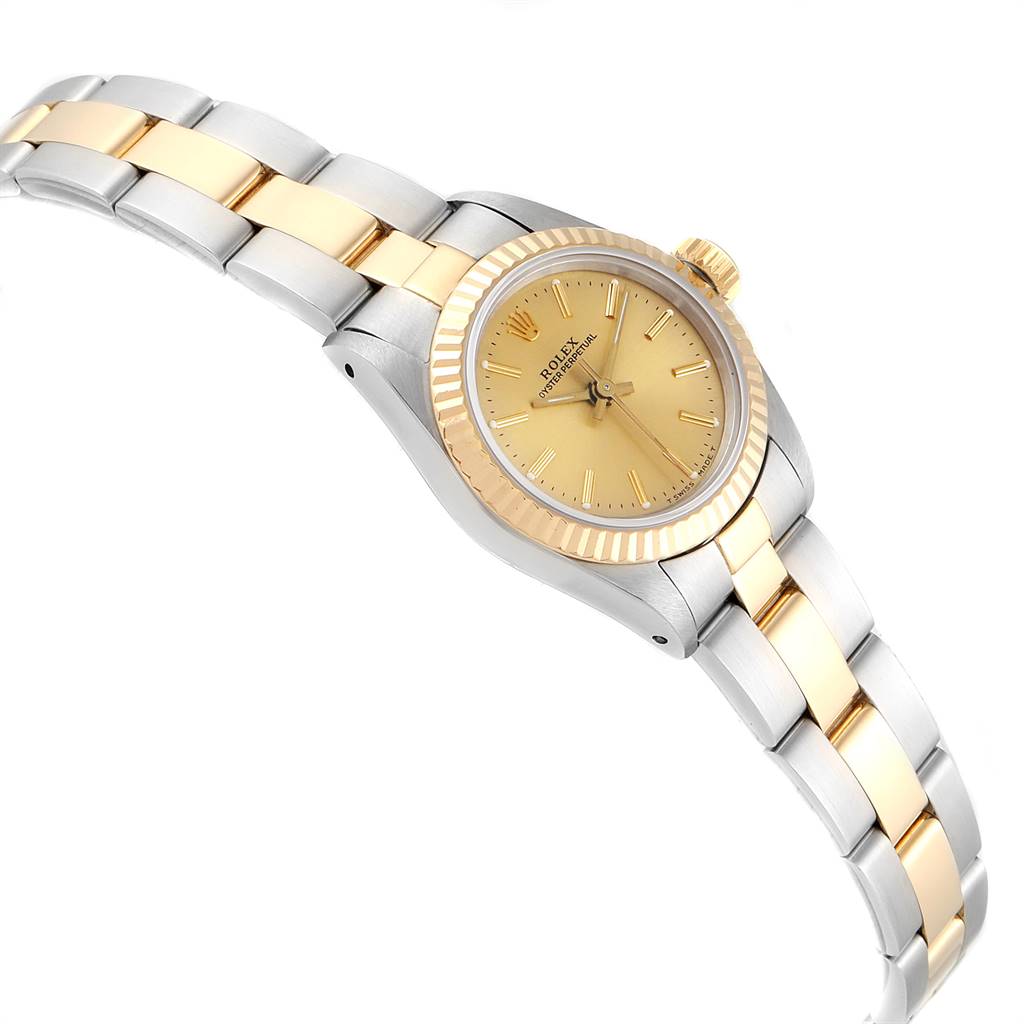 The image shows a Rolex Oyster Perpetual 67193 Women's Steel and Gold (two tone) Champagne Dial 67193 Women's Steel and Gold (two tone) Champagne Dial watch angled from the front-left, highlighting the gold bezel, gold dial, and two-tone bracelet.