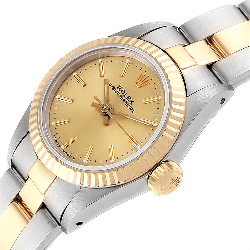 The Rolex Oyster Perpetual 67193 Women's Steel and Gold (two tone) Champagne Dial 67193 Women's Steel and Gold (two tone) Champagne Dial watch is displayed at a close angle showing the face, bezel, crown, and part of the metallic bracelet.