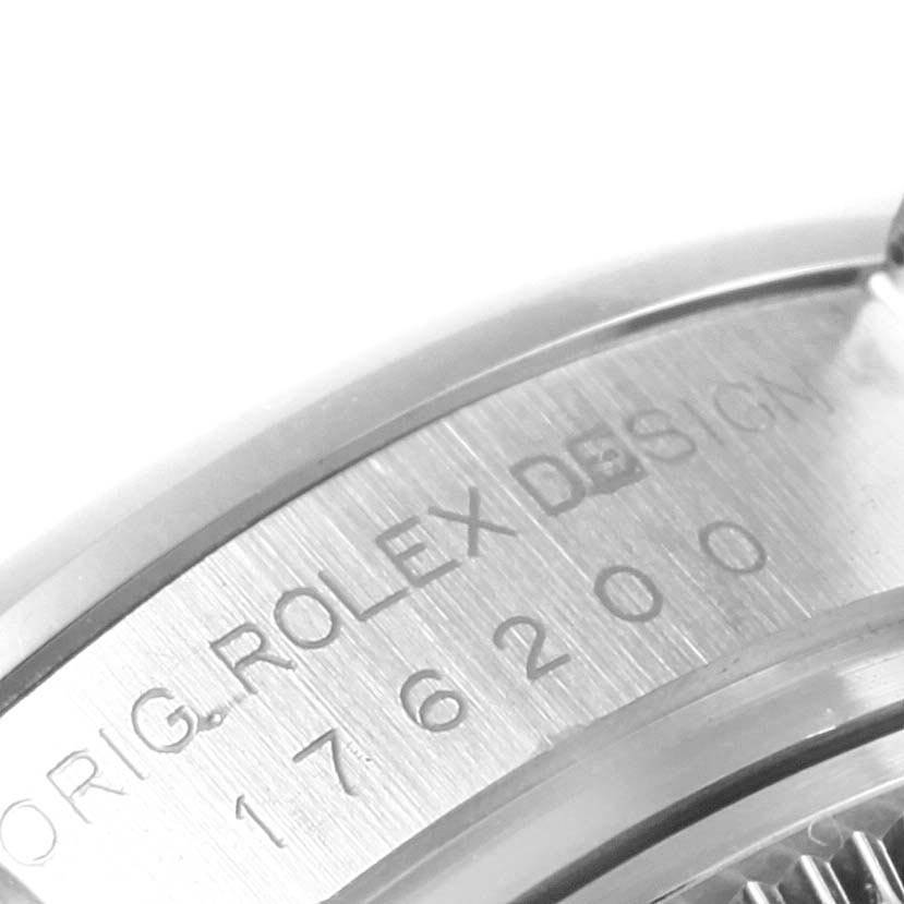 The image shows a close-up of the engraved side of a Rolex Oyster Perpetual 176200 Women
s Stainless Steel Black Dial 176200 Women
s Stainless Steel Black Dial watch, displaying the model number.
