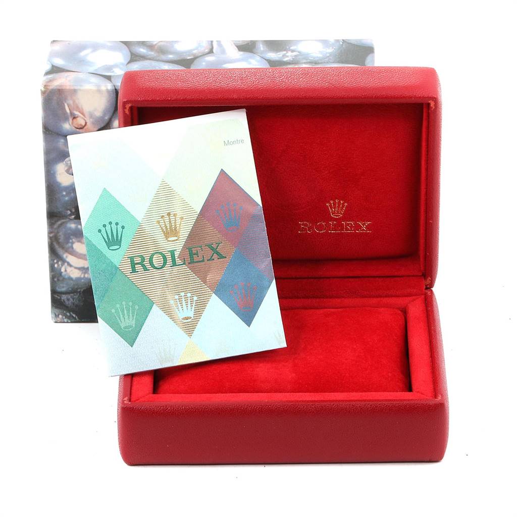 The image shows a red Rolex Oyster Perpetual 76080 Women's Stainless Steel Pink Dial 76080 Women's Stainless Steel Pink Dial watch box and an accompanying booklet, seen from a front angle.