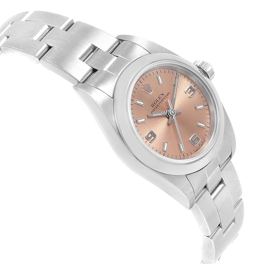 The Rolex Oyster Perpetual 76080 Women's Stainless Steel Pink Dial 76080 Women's Stainless Steel Pink Dial watch is shown at an angled side view, displaying its bracelet, case, dial, and crown.