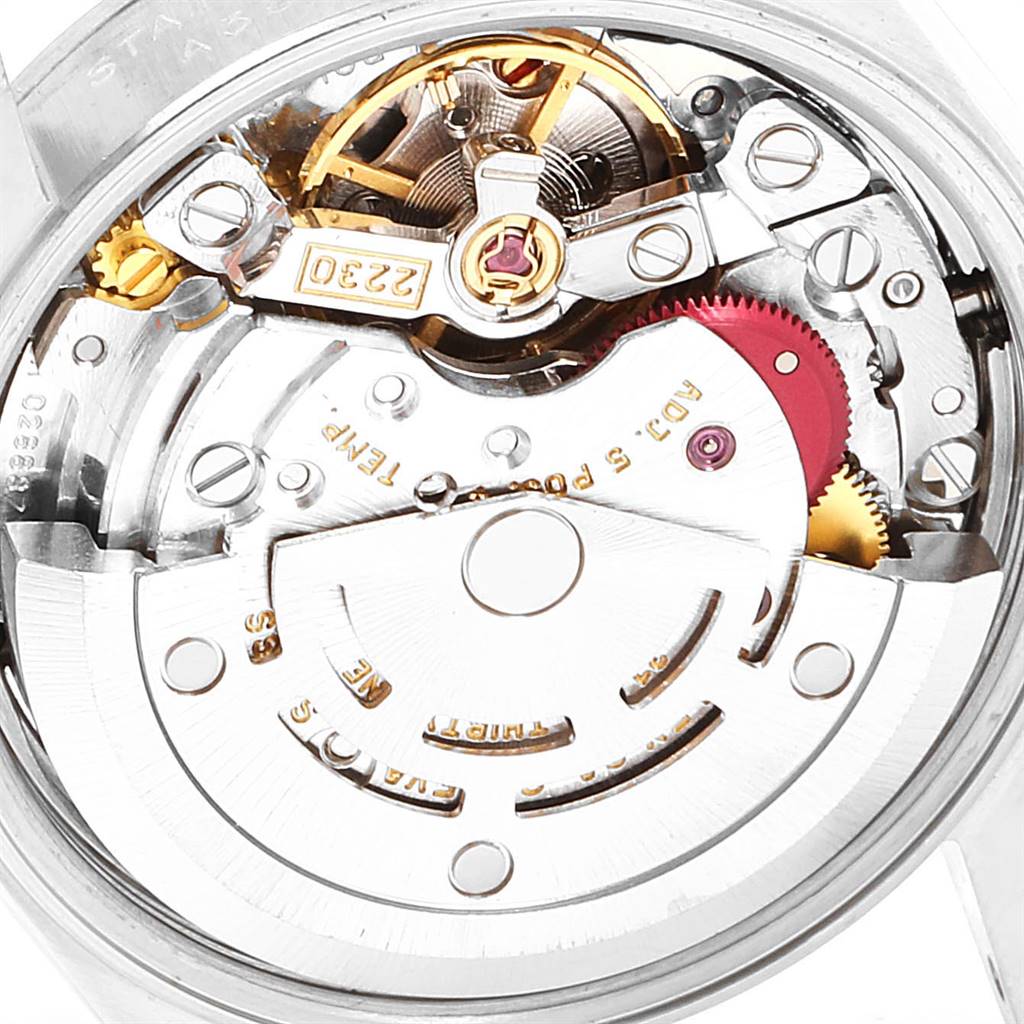 This image shows the intricate internal movement mechanism of a Rolex Oyster Perpetual 76080 Women
s Stainless Steel White Dial 76080 Women
s Stainless Steel White Dial watch from a close-up angle.