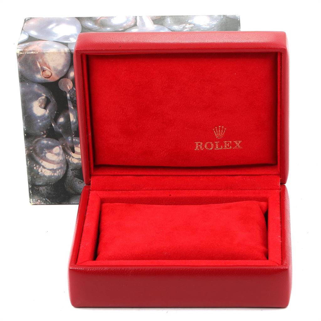 The image shows an open red Rolex box with a matching red cushion inside, intended for the Oyster Perpetual model.