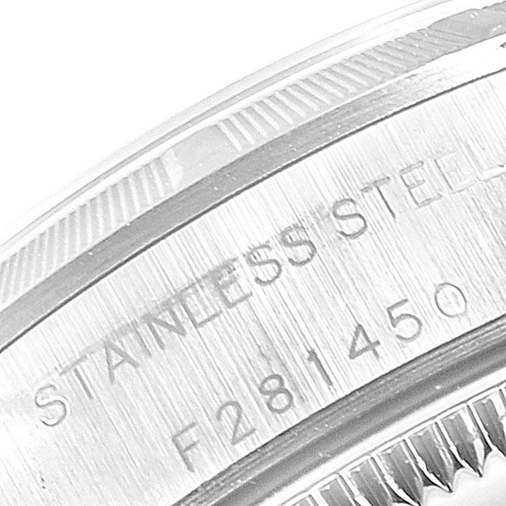 The image shows a close-up of the engraved stainless steel back of a Rolex Oyster Perpetual 76030 Women's Stainless Steel Black Dial 76030 Women's Stainless Steel Black Dial watch.