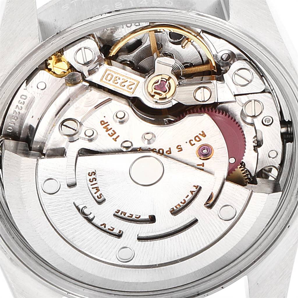 The image shows the intricate internal mechanism and movement of a Rolex Oyster Perpetual 76030 Women's Stainless Steel Black Dial 76030 Women's Stainless Steel Black Dial watch from a rear angle.