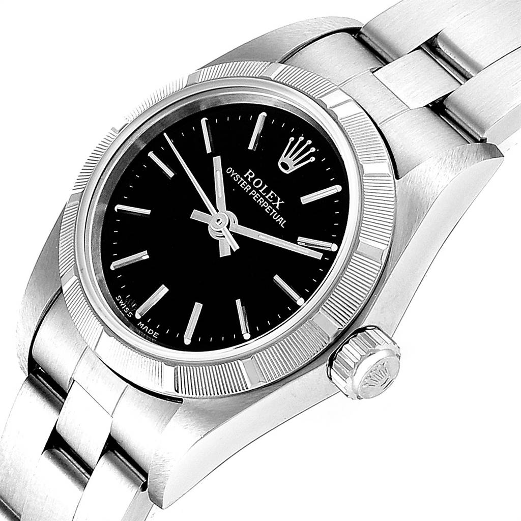 The image shows a close-up of the Rolex Oyster Perpetual 76030 Women's Stainless Steel Black Dial 76030 Women's Stainless Steel Black Dial watch, highlighting its black dial, crown, bezel, and part of the bracelet.