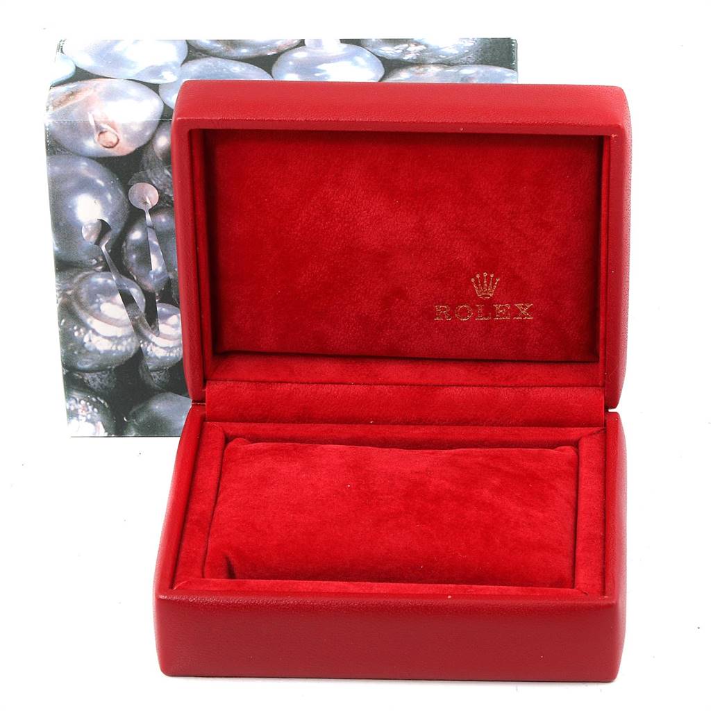 This image shows an open red Rolex box with a cushion designed for an Oyster Perpetual model by Rolex.