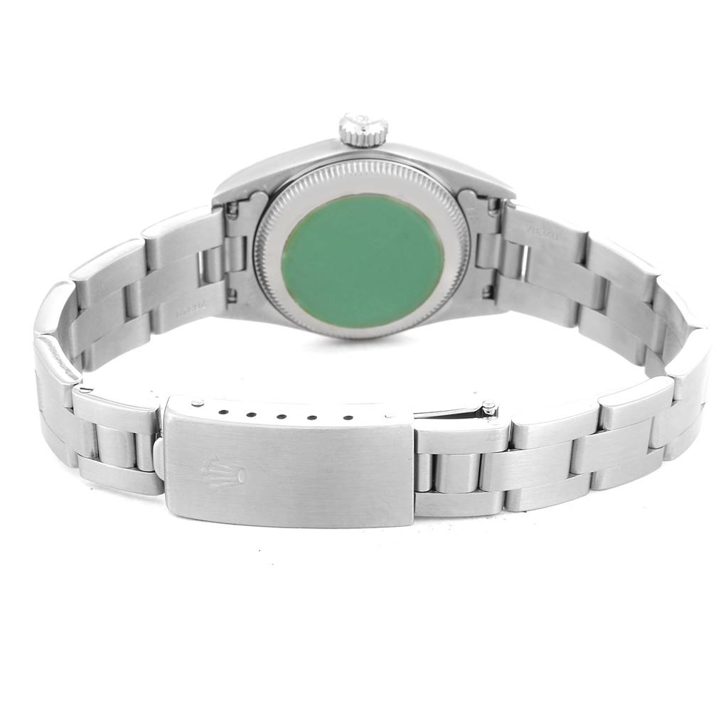 This image shows the back view of a Rolex Oyster Perpetual 67230 Women's Stainless Steel Pink Dial 67230 Women's Stainless Steel Pink Dial watch, highlighting its clasp, bracelet, and case back.