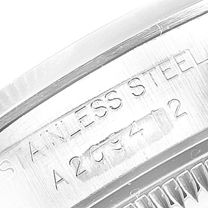 This image shows a close-up of the stainless steel back casing with the engraving of the Rolex Oyster Perpetual 76080 Women's Stainless Steel Pink Dial 76080 Women's Stainless Steel Pink Dial model.